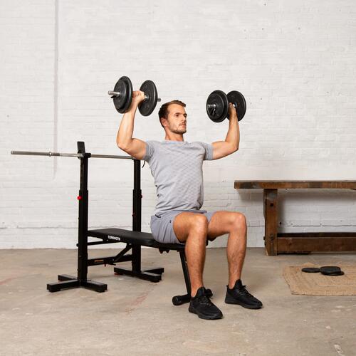 Image of man lifting weights on a bench