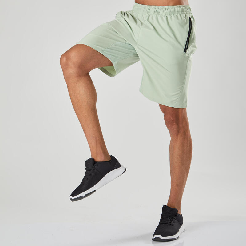 Short de fitness essentiel respirant poches zippés homme - vert