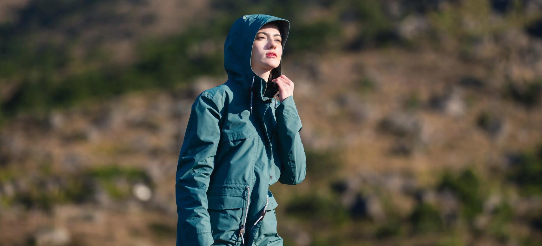 Woman wearing down jacket while hiking.