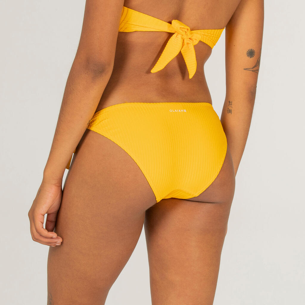 Sieviešu sānos sasienama sērfošanas peldkostīma apakšdaļa “Sofy”, dzeltena
