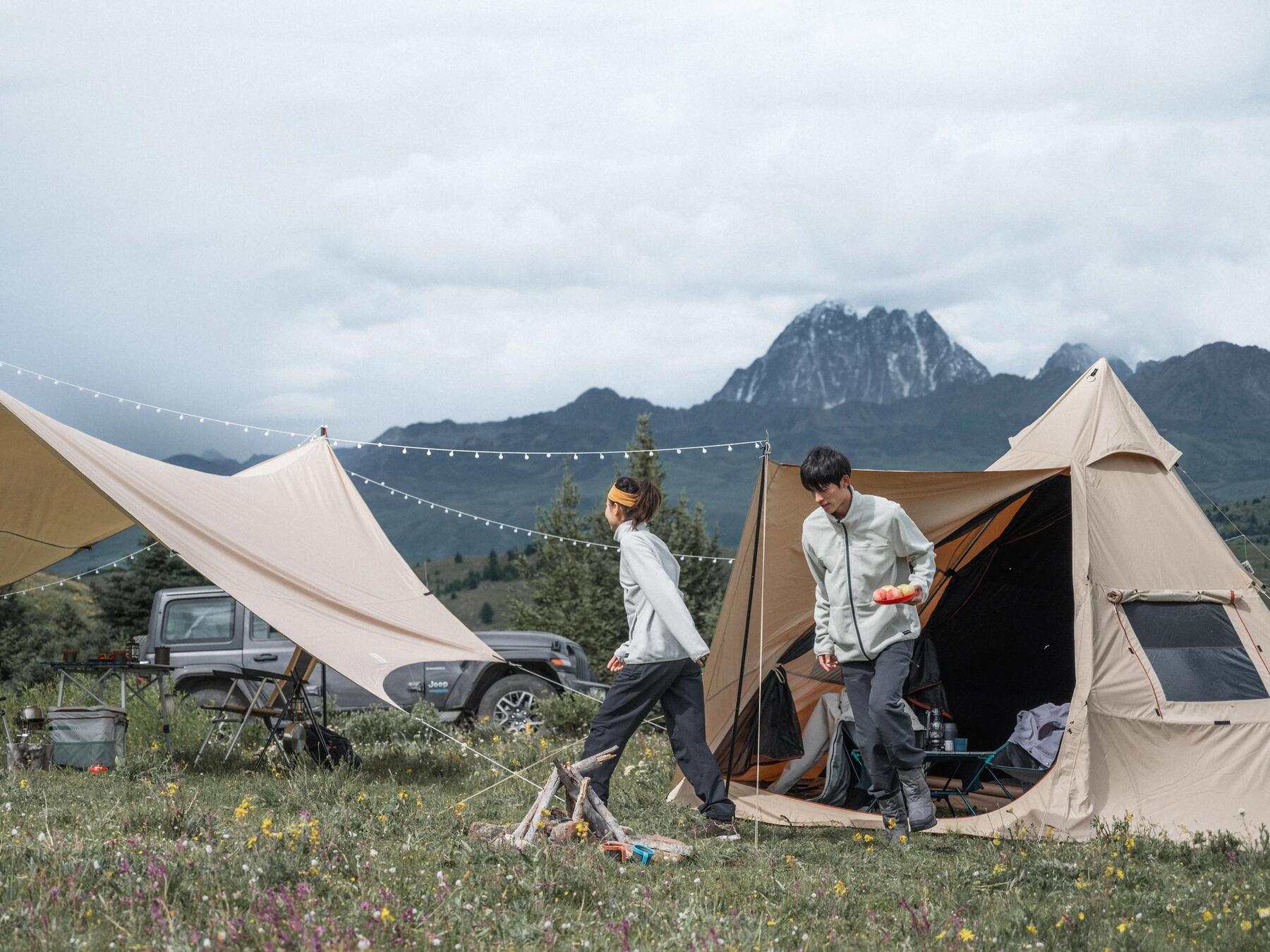 Couple inside a tepee tent