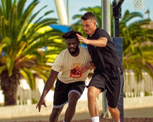 Close-up of men playing basketball 