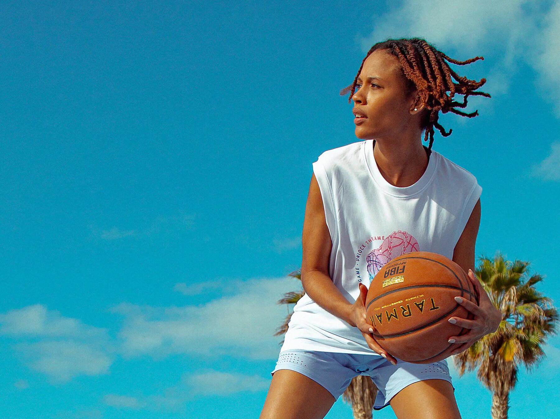 Women playing basket on a sunny day