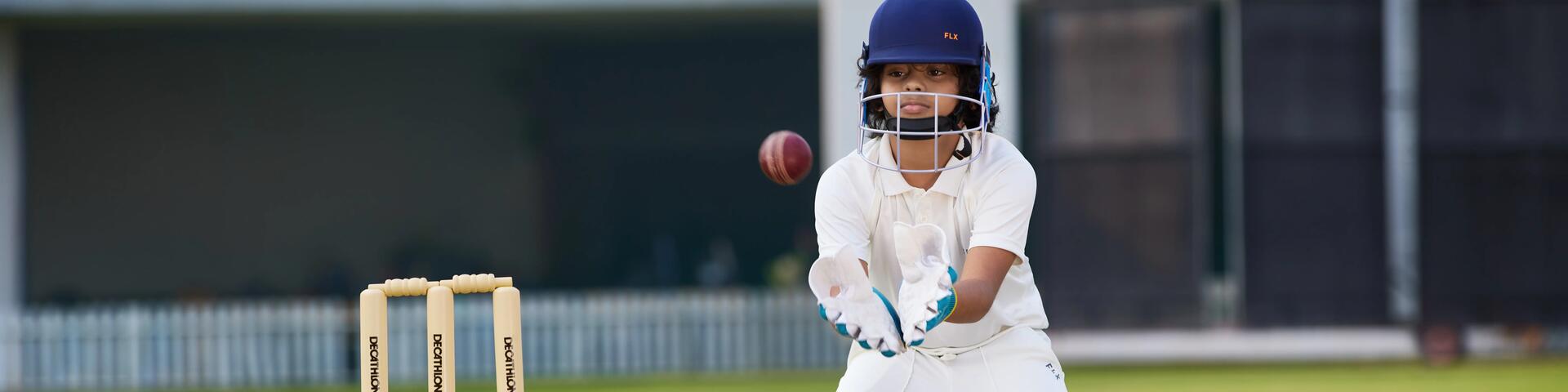 Boy playing cricket