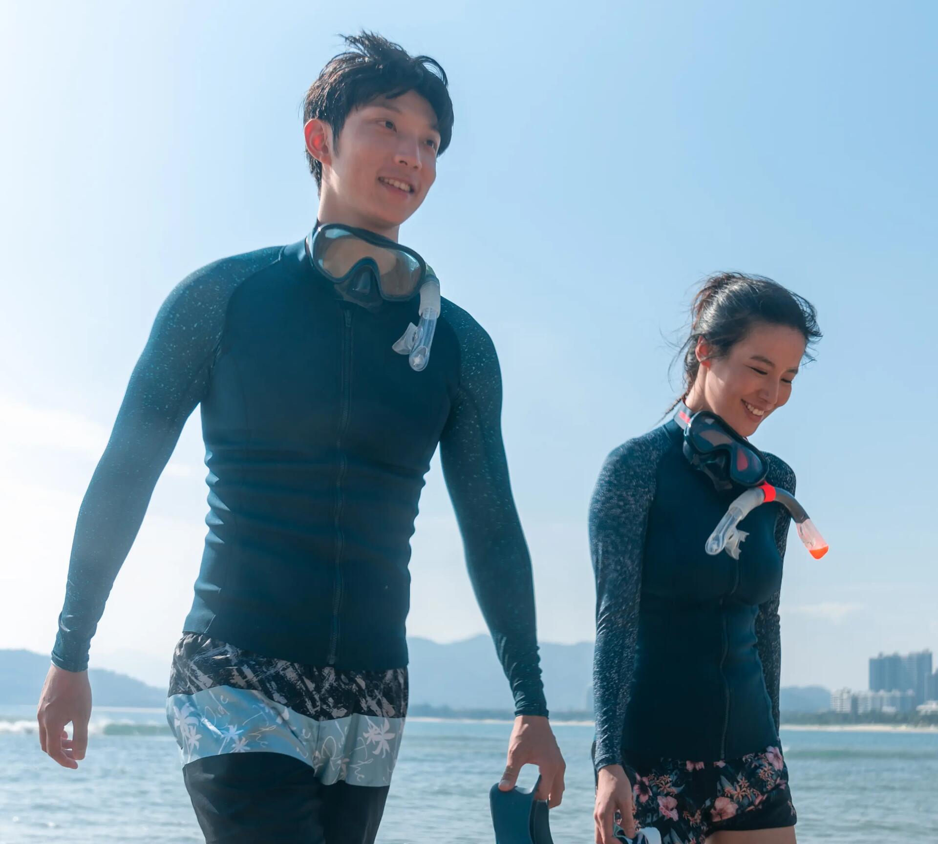 man and woman wearing snorkeling tops