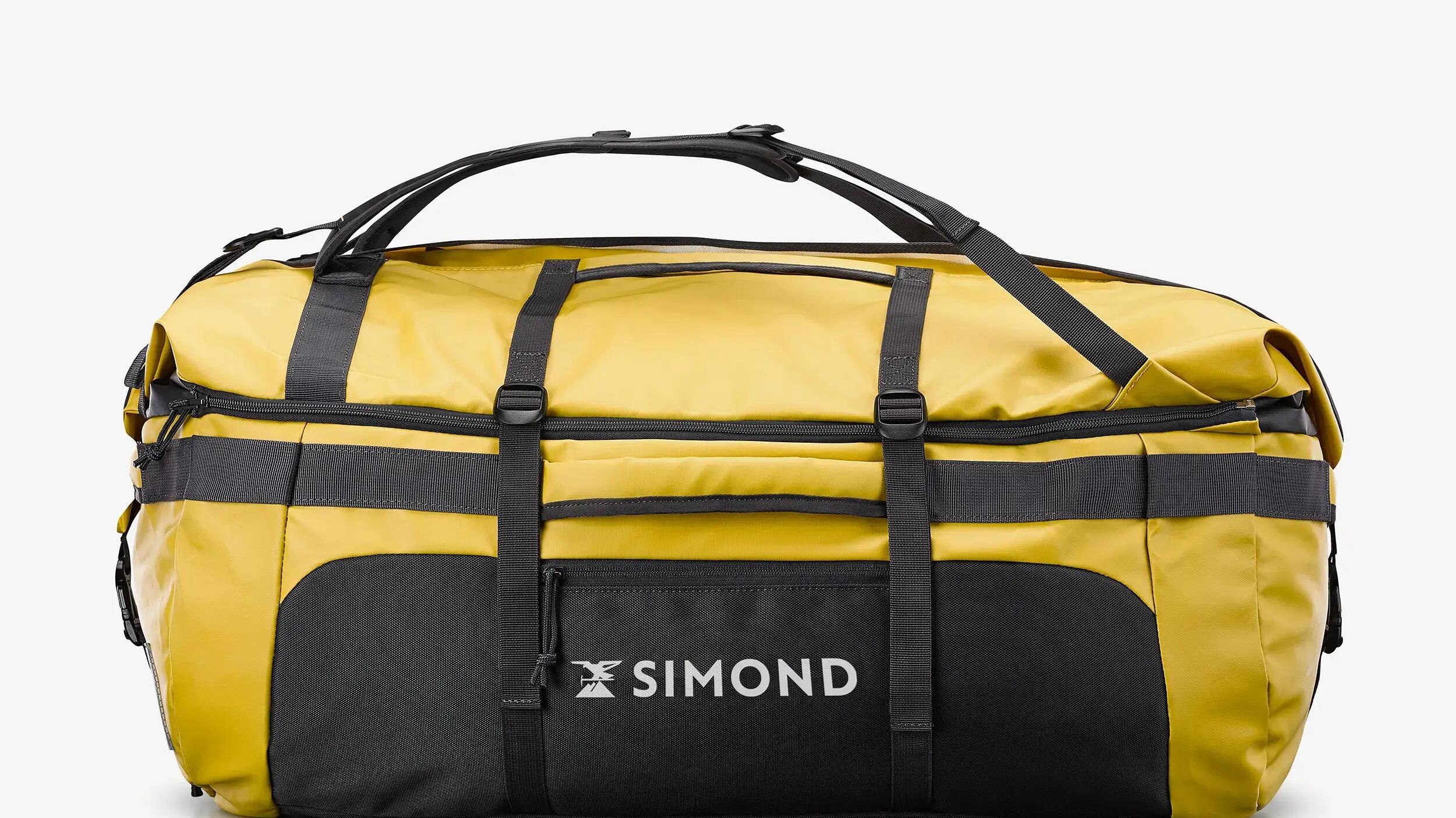 Een gele Extend 80/120L-tas voor trekking repareren