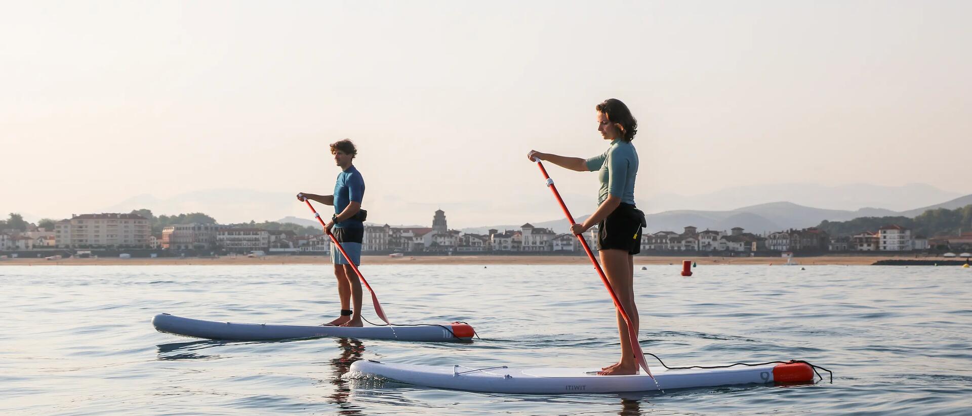 two people on stand up paddles 