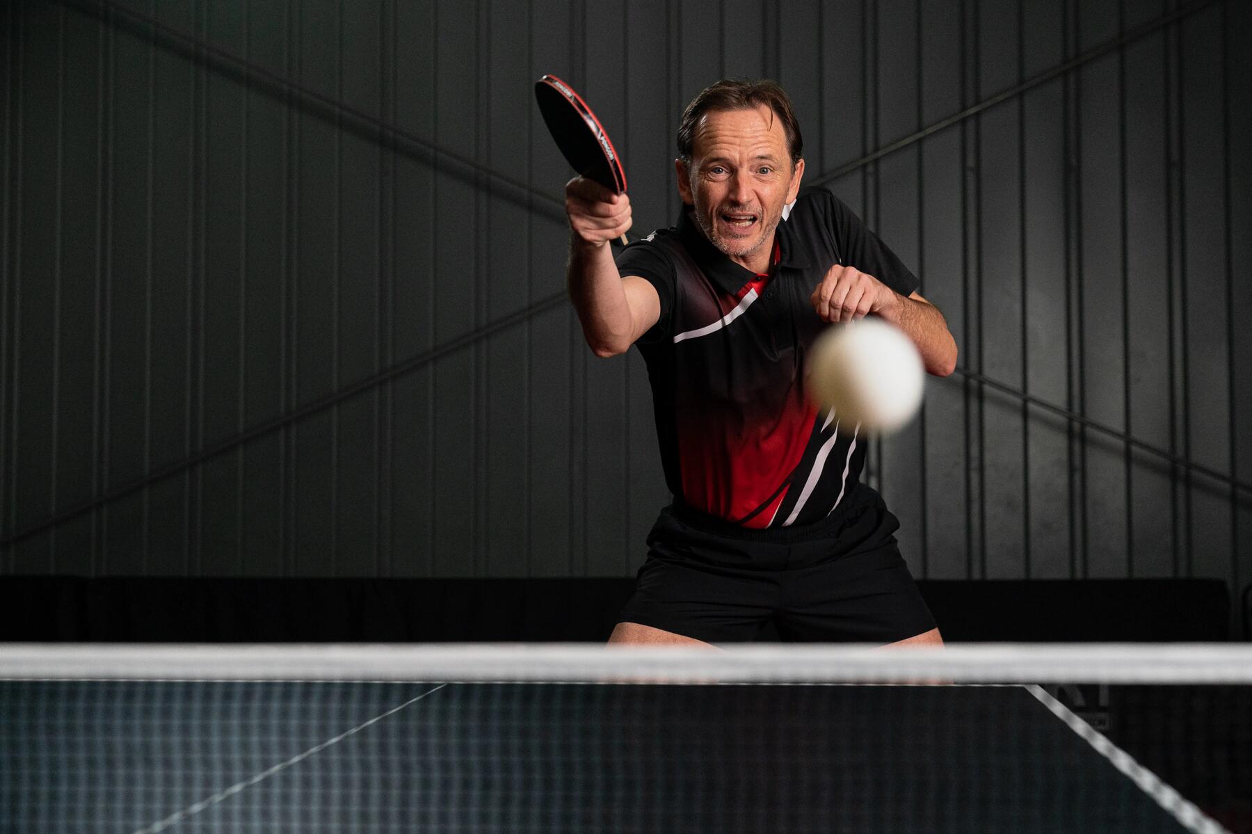 Man holding table tennis bat