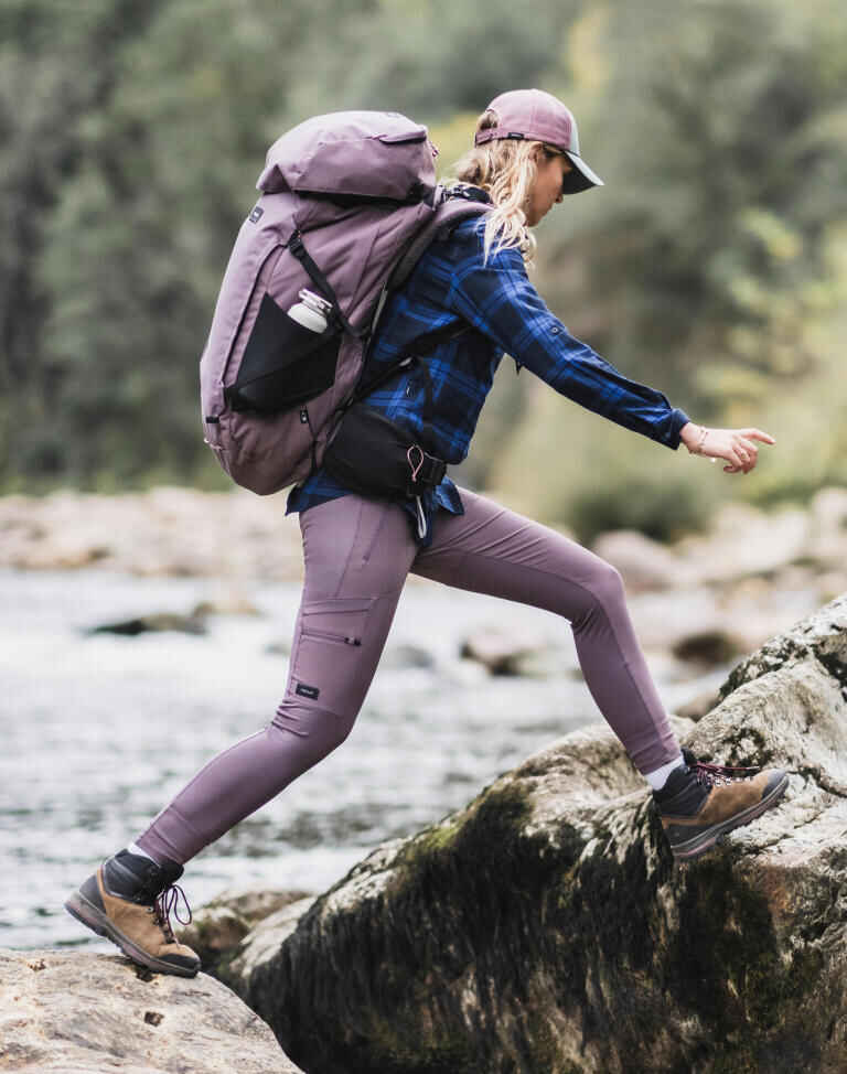 Woman hiking by the river