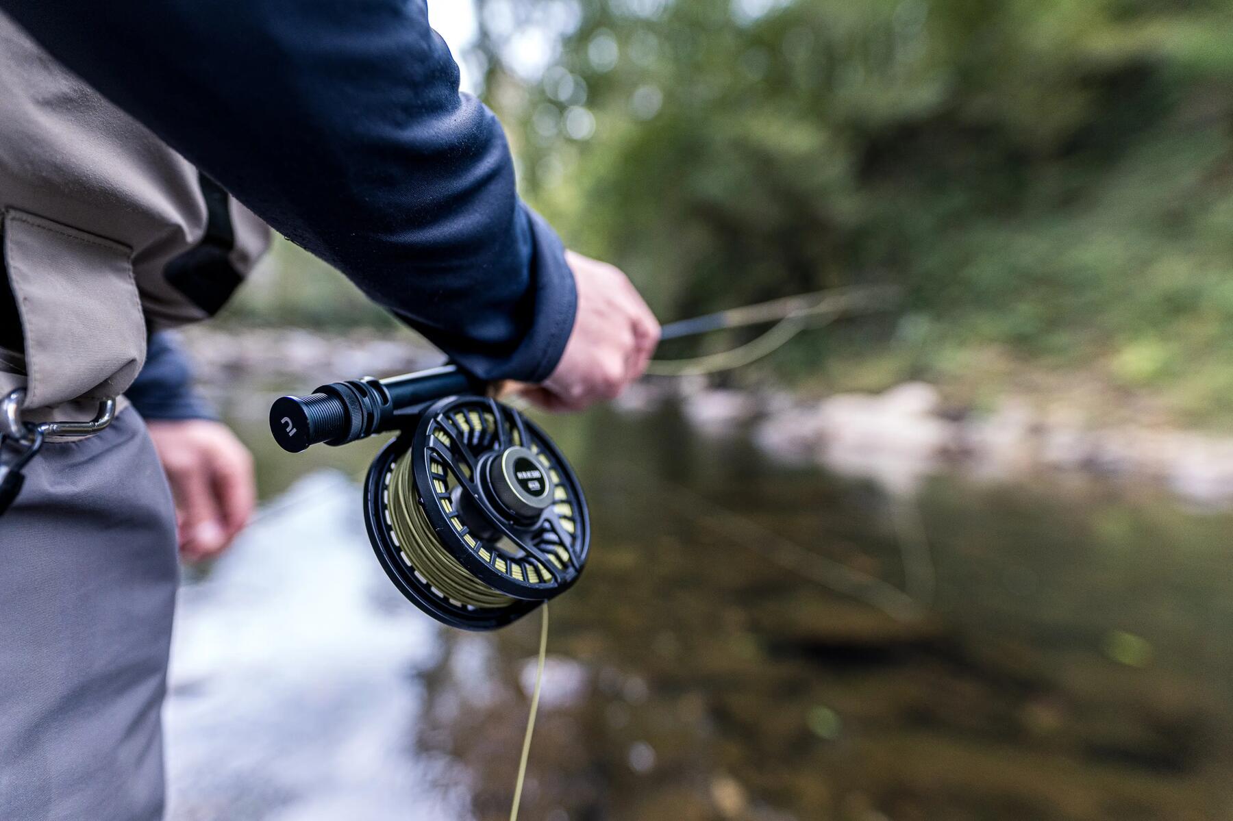 man holding his fishing rod