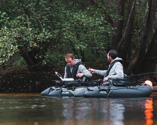 Two men on boat fishing