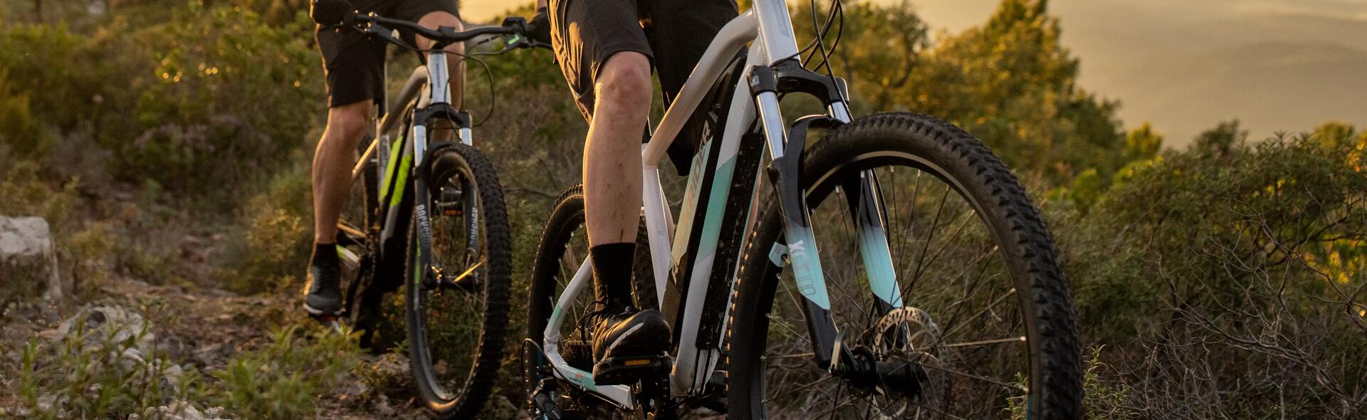 two people cycling on the mountain