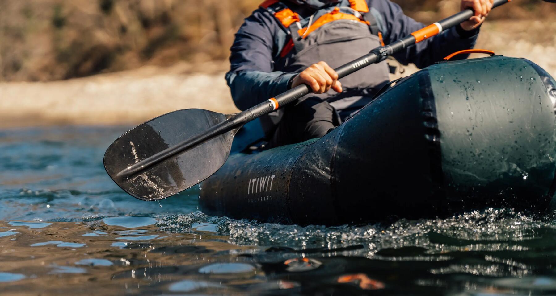 Close-up of man paddling kayak