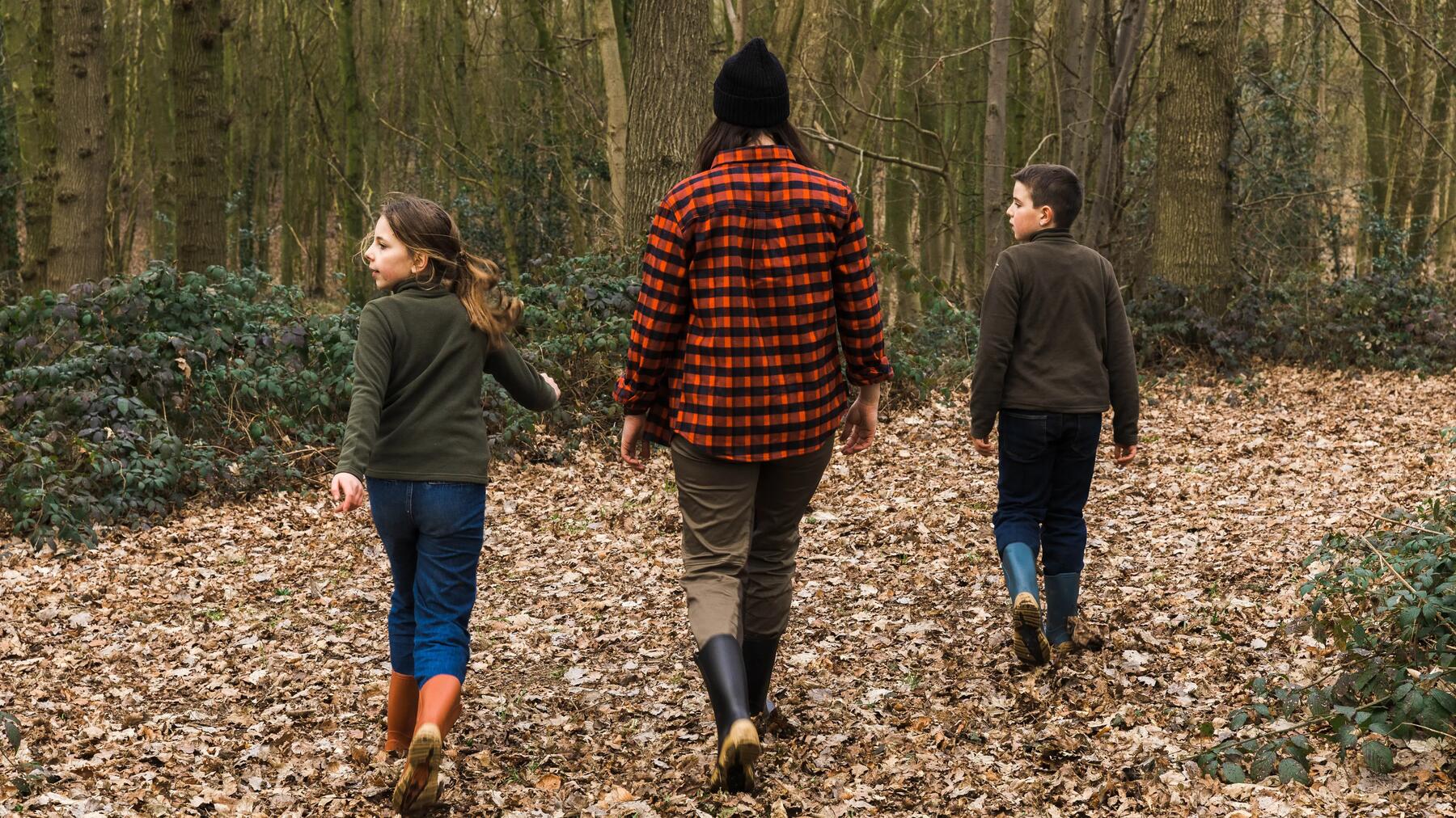 young boy walking outside