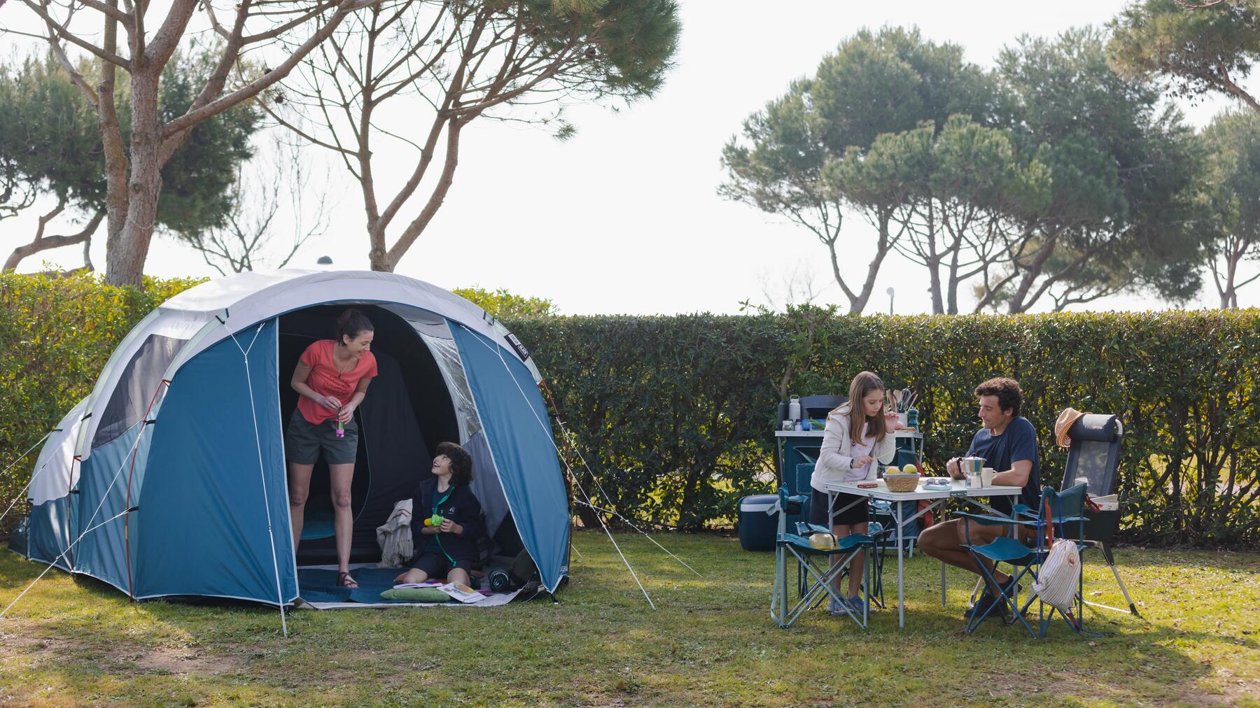  A group of people gathered around a camping table 