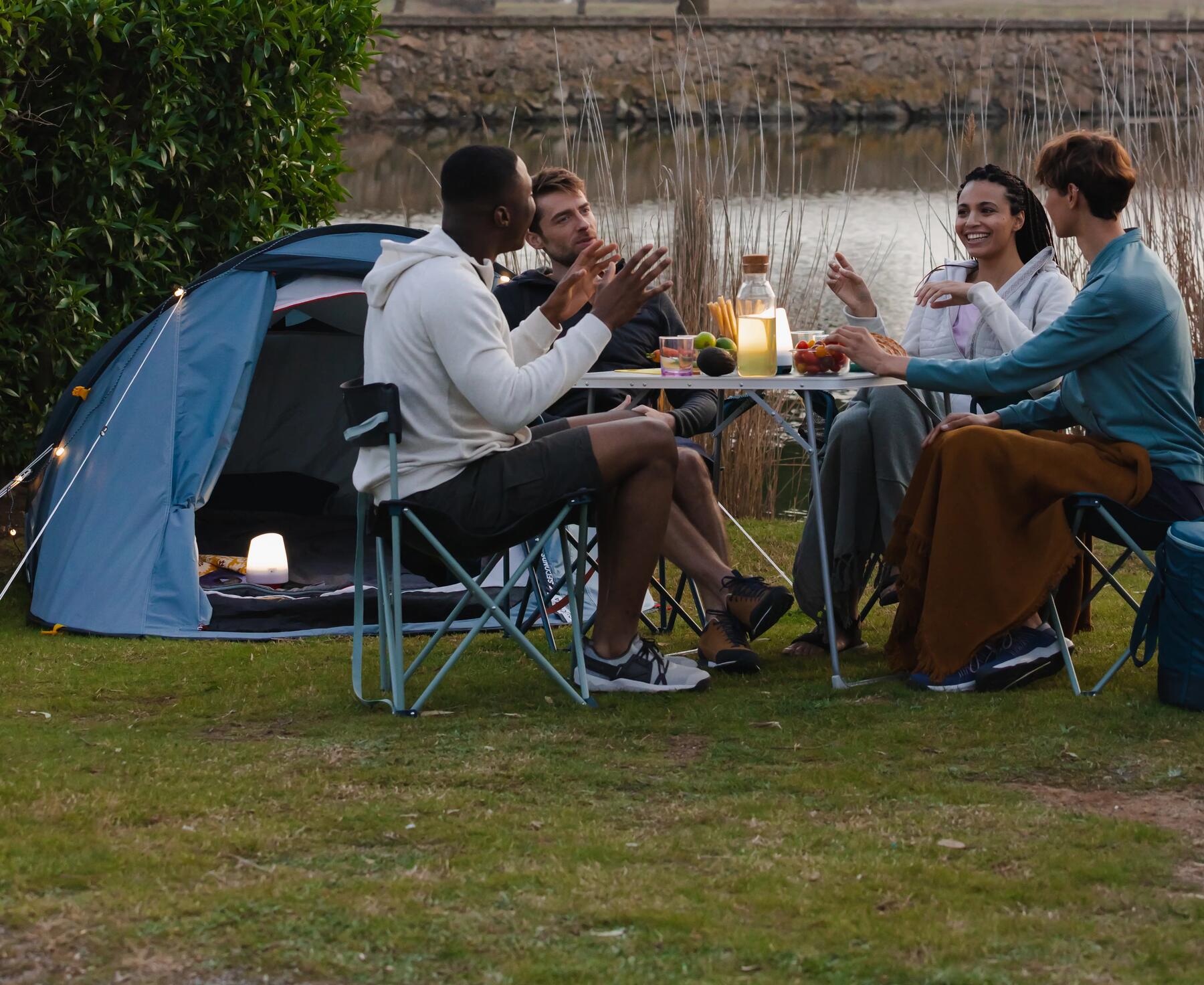 A group of people gathered around a camping table 