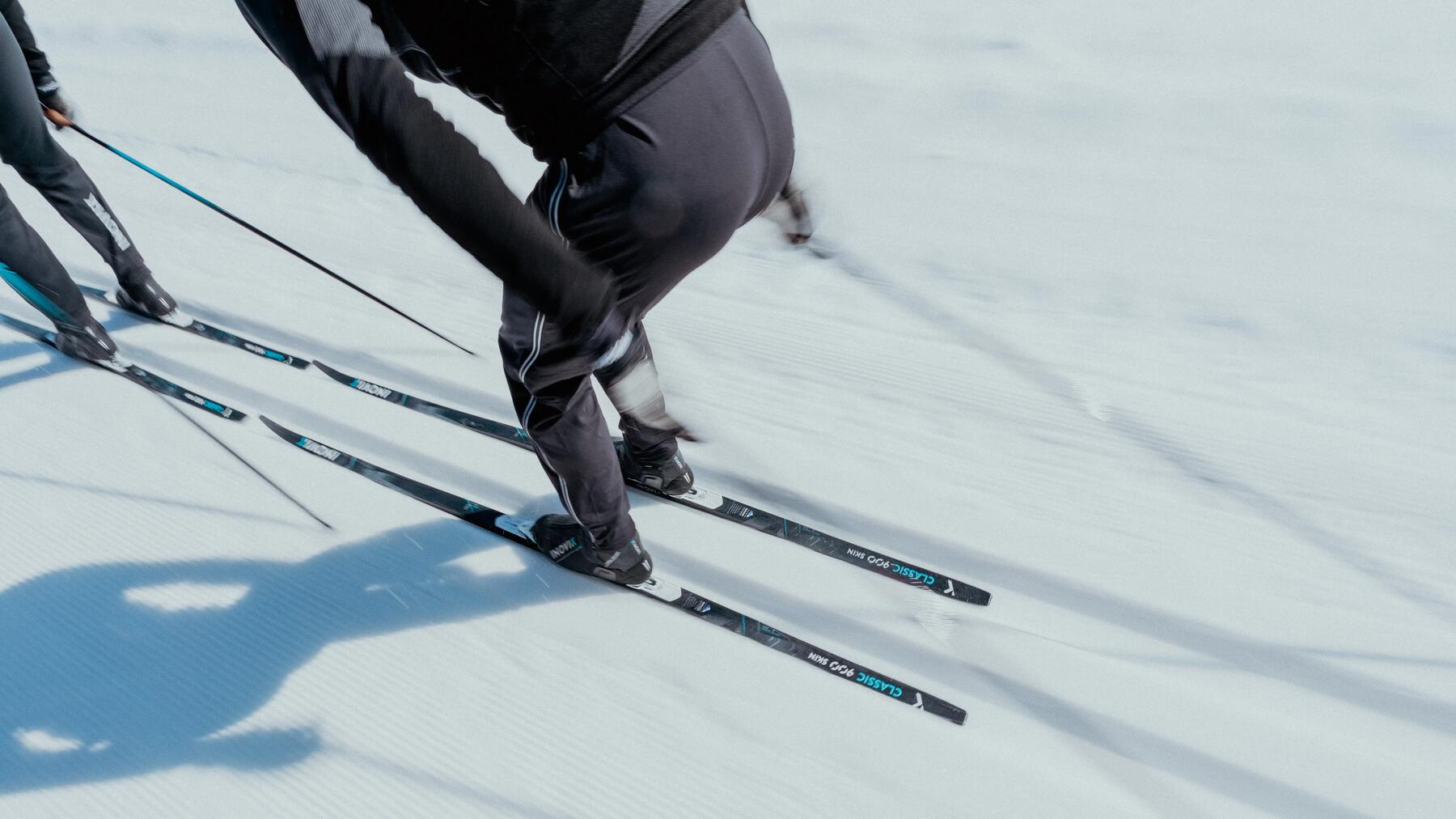 two people cross-country skiing