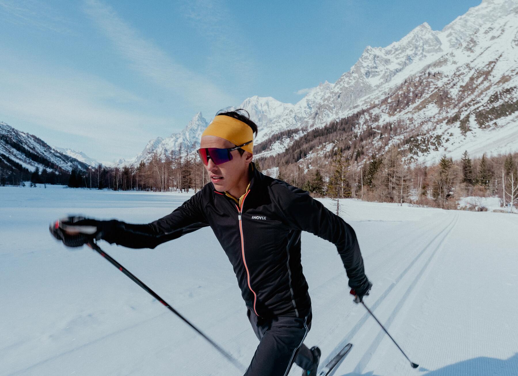 A young man cross-country skiing