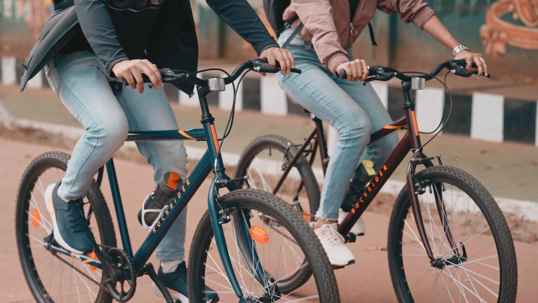 friends who pedal on a landscaped path