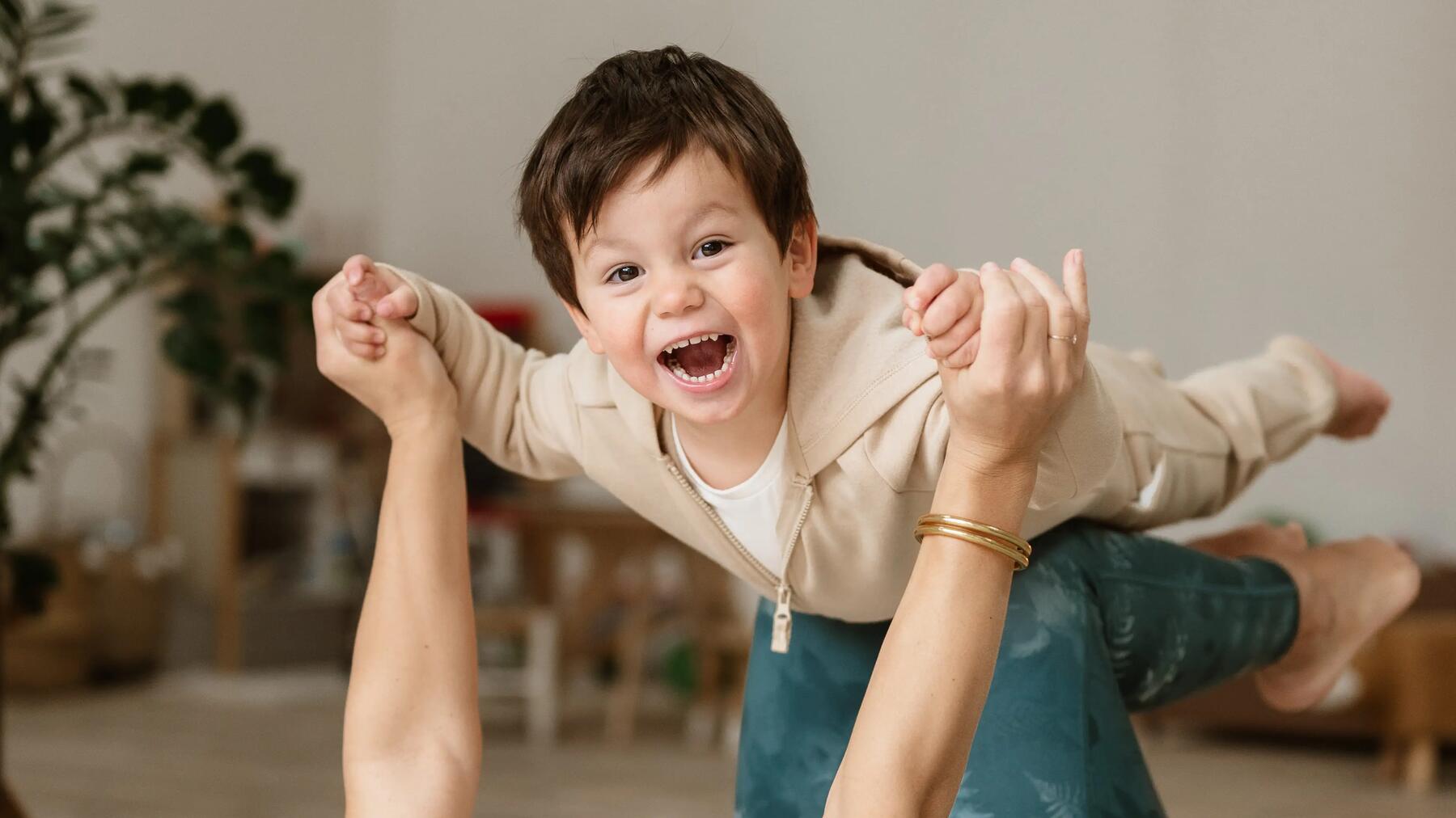 mom does yoga with her son