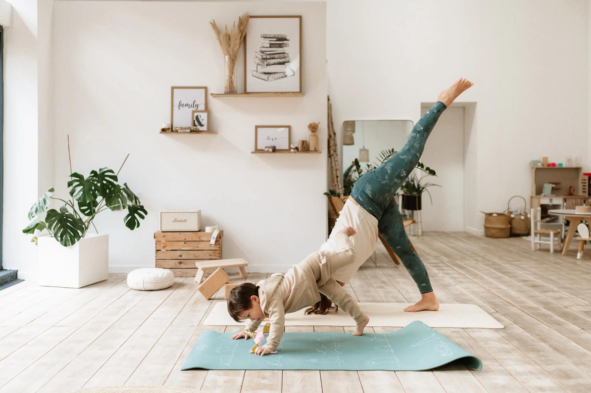 Mum doing yoga with daughter
