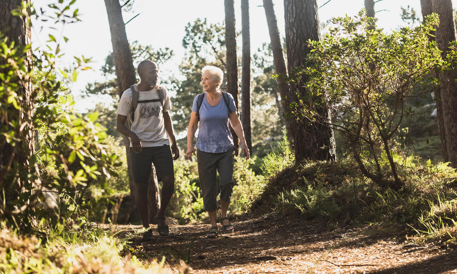 Man and woman on a hiking trail. 