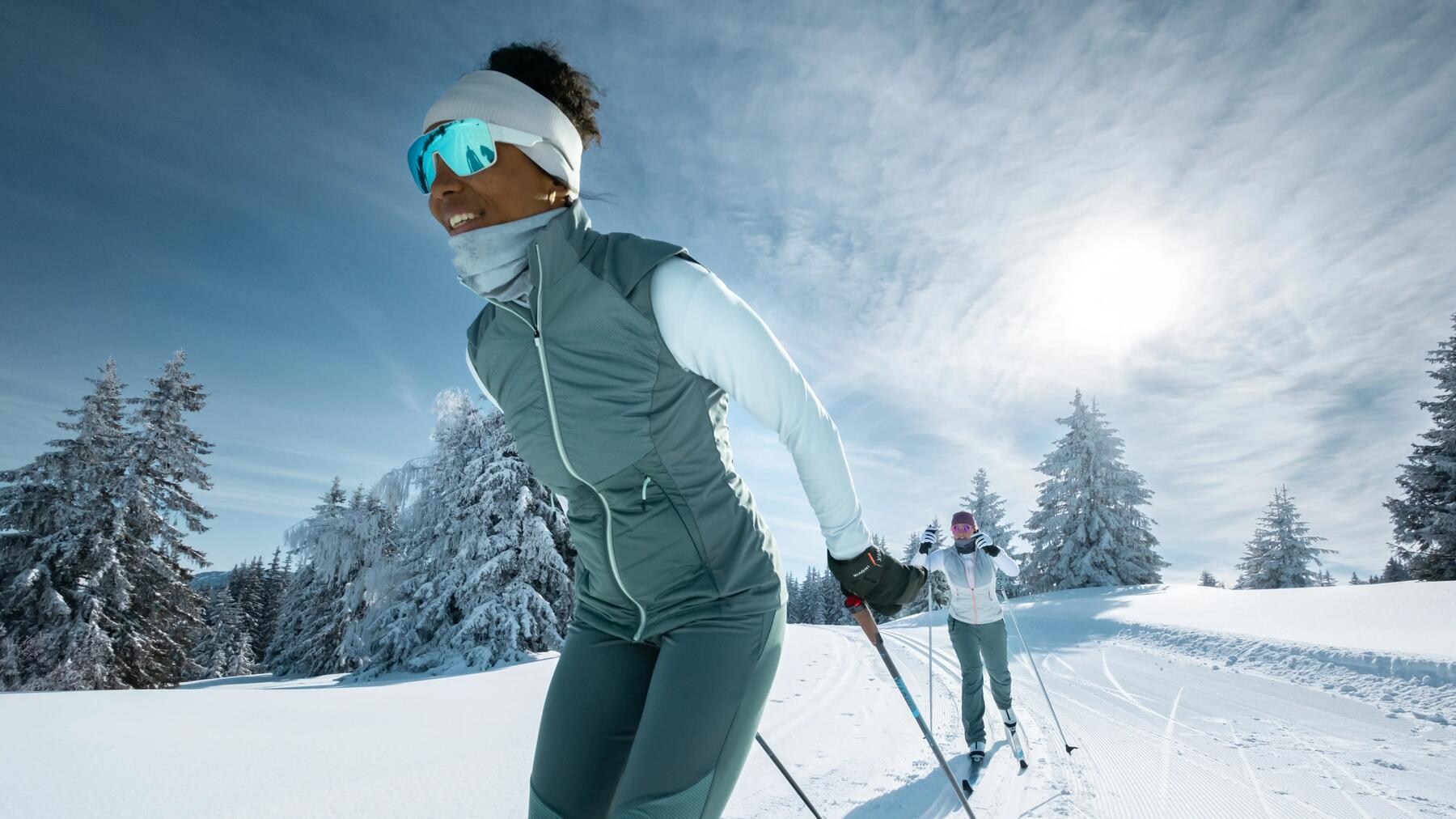 woman and man cross-country skiing