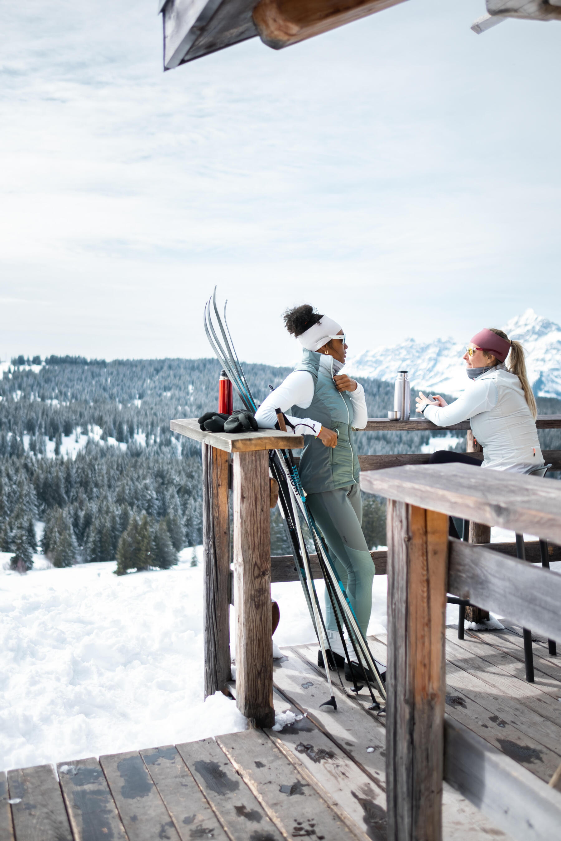 woman take off her cross-country skiing jacket