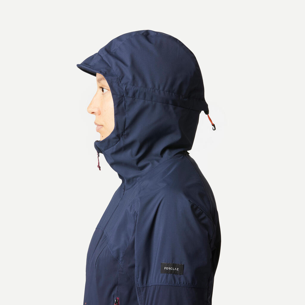 Sieviešu kalnu trekinga vēju aizturošā softshell jaka “MT900”, tumši zila