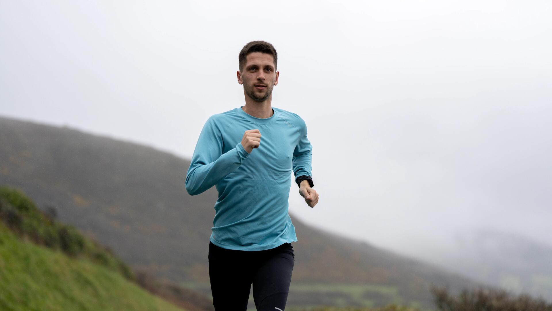 man focused on their running 