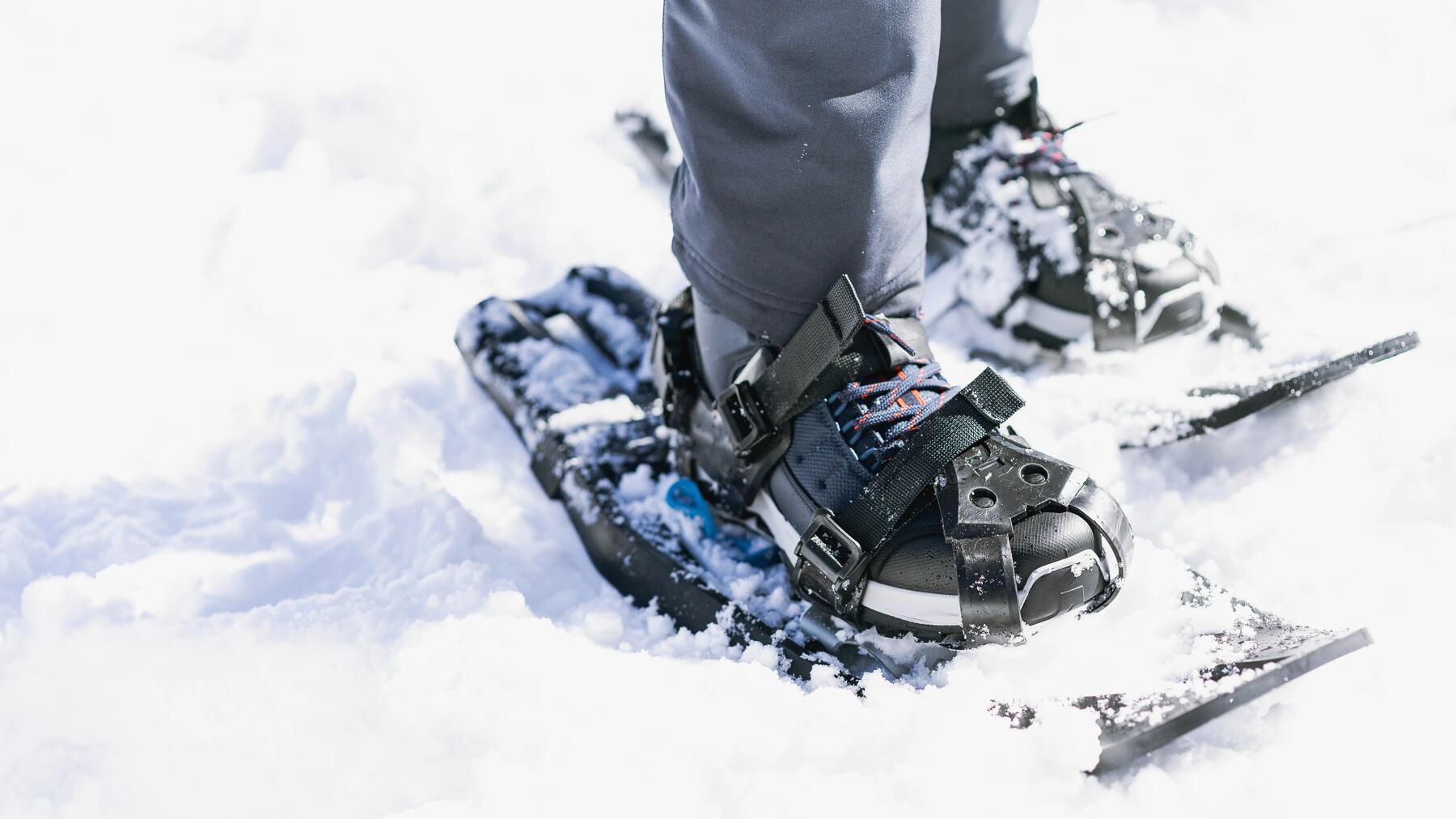 Couple snowshoeing on an uphill slope
