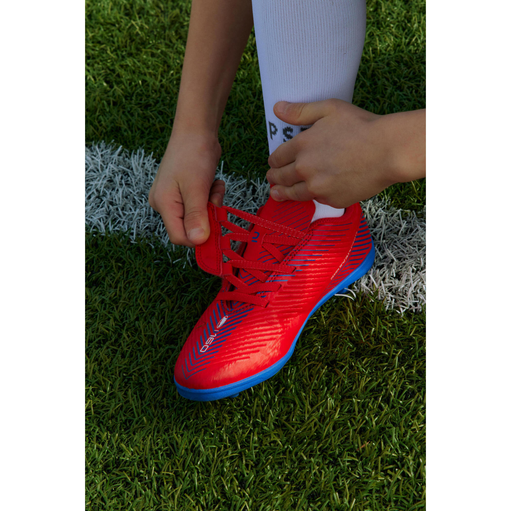 Scarpe calcio bambino 160 EASY AG FG con strap rosse KIPSTA