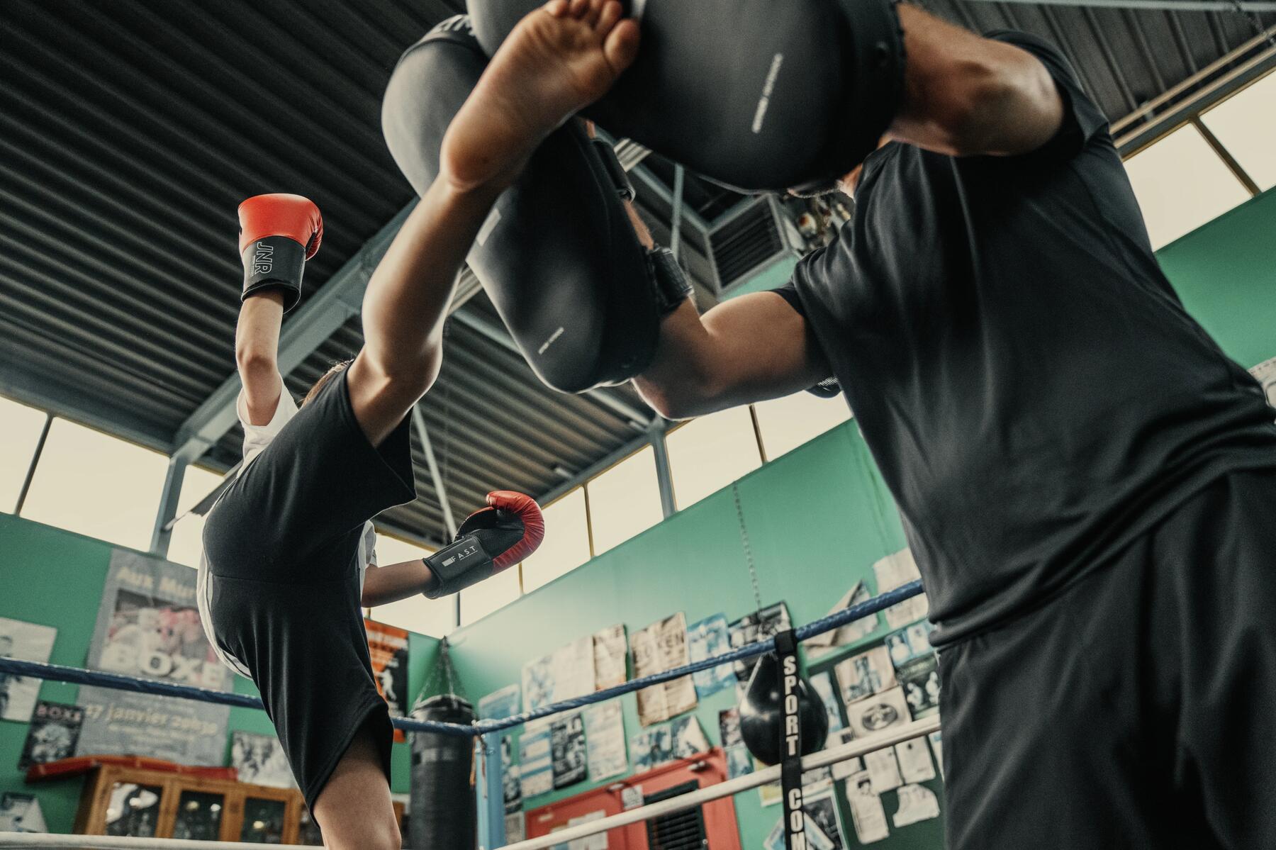 People kickboxing in the living room