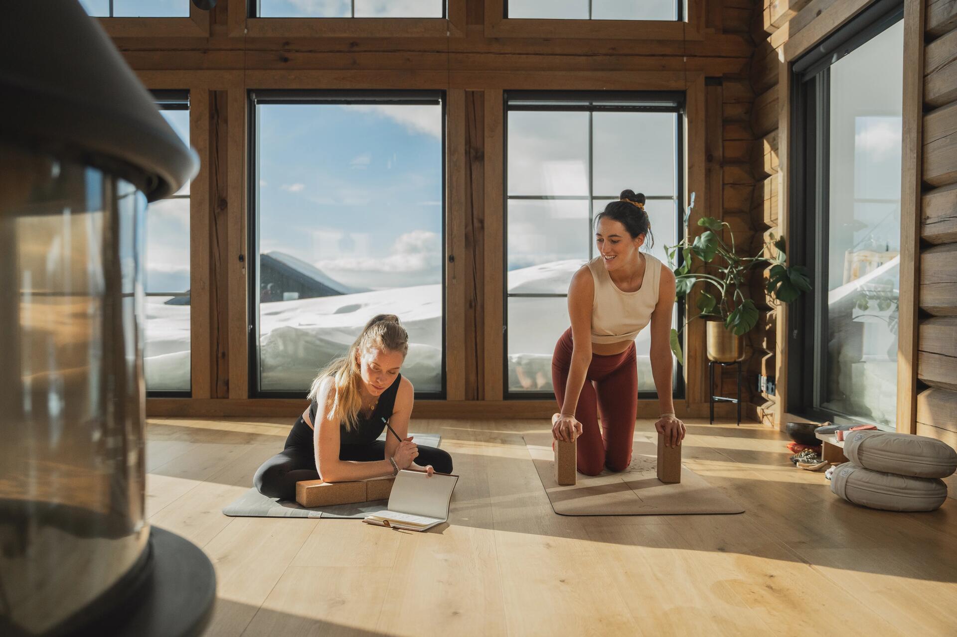 two women doing yoga