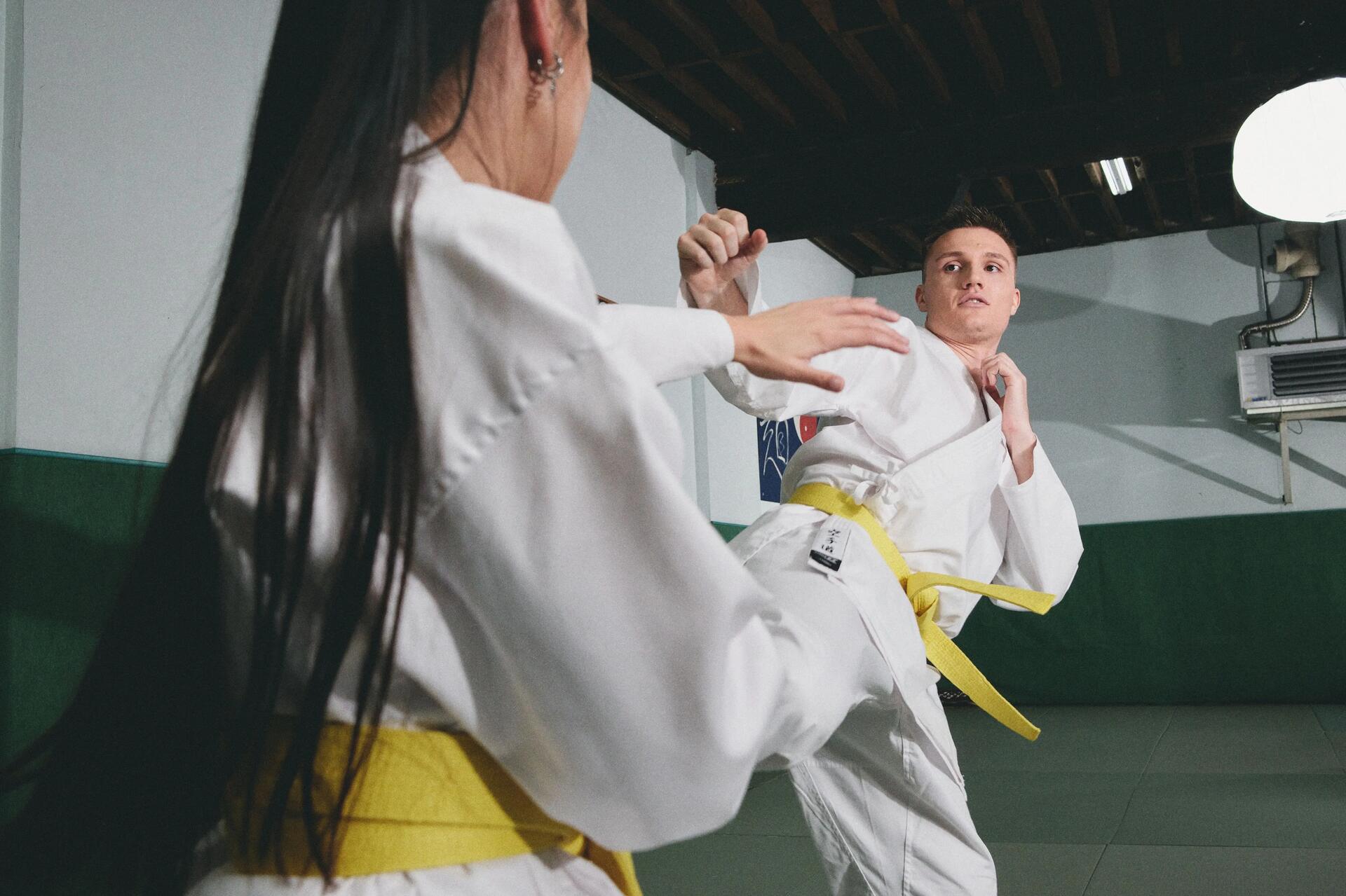 Child and adult doing karate