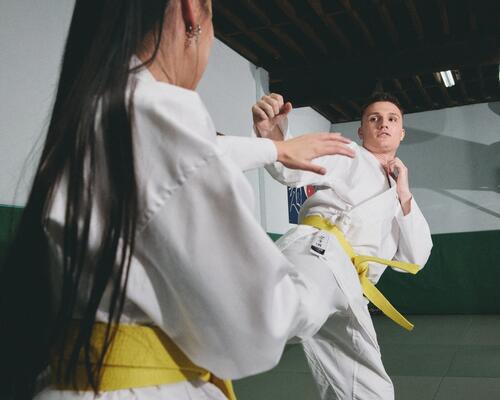man and young boy practicing karate