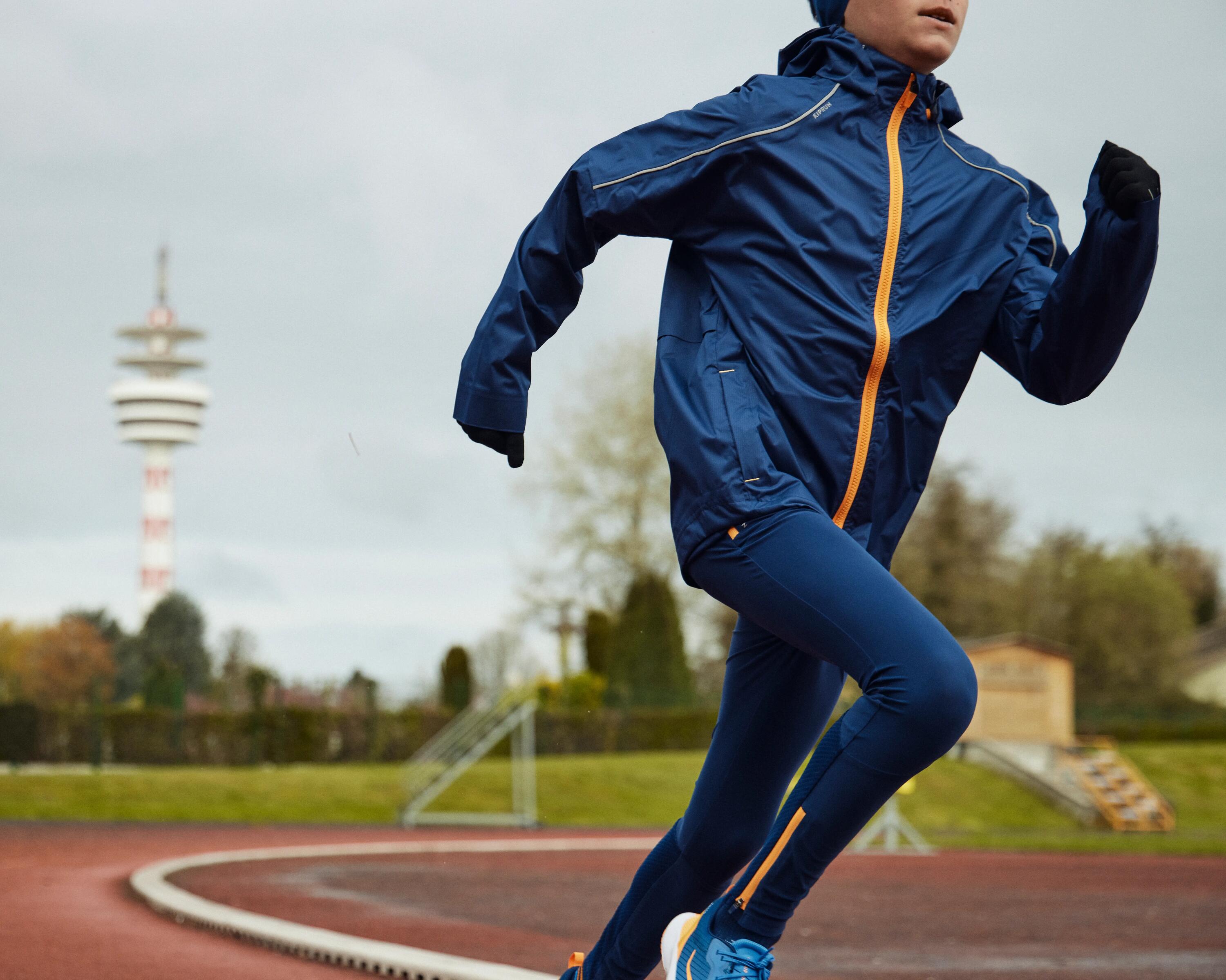 KIPRUN RAIN kid's waterproof running jacket - Blue/Orange 20/21