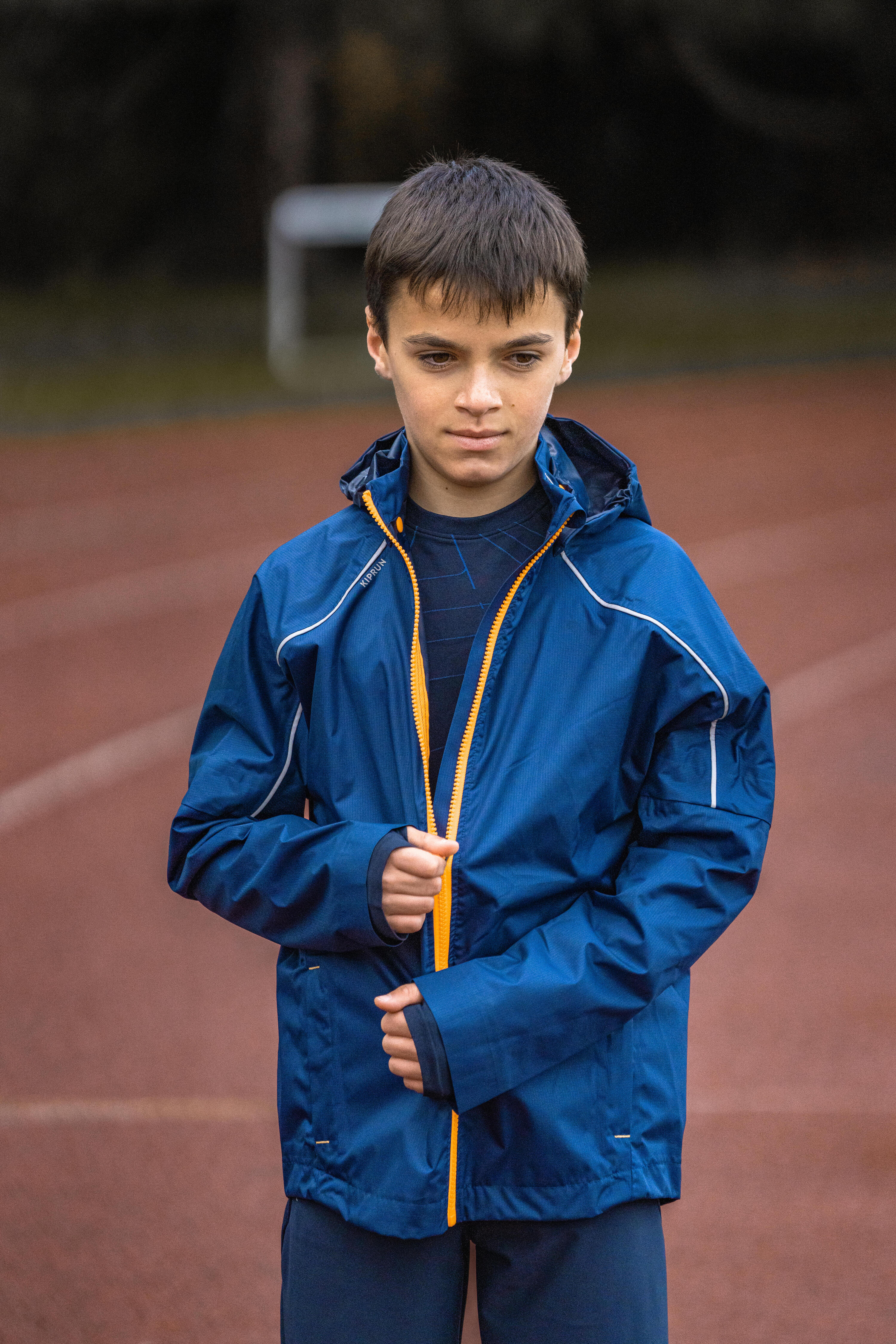 KIPRUN RAIN kid's waterproof running jacket - Blue/Orange 16/21