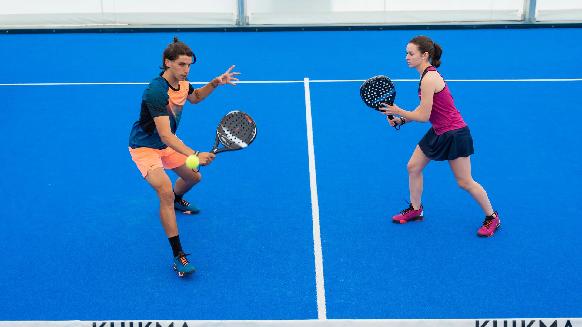 man and woman playing padel as doubles