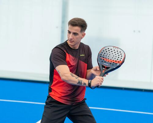 Close-up of man holding padel racket during play