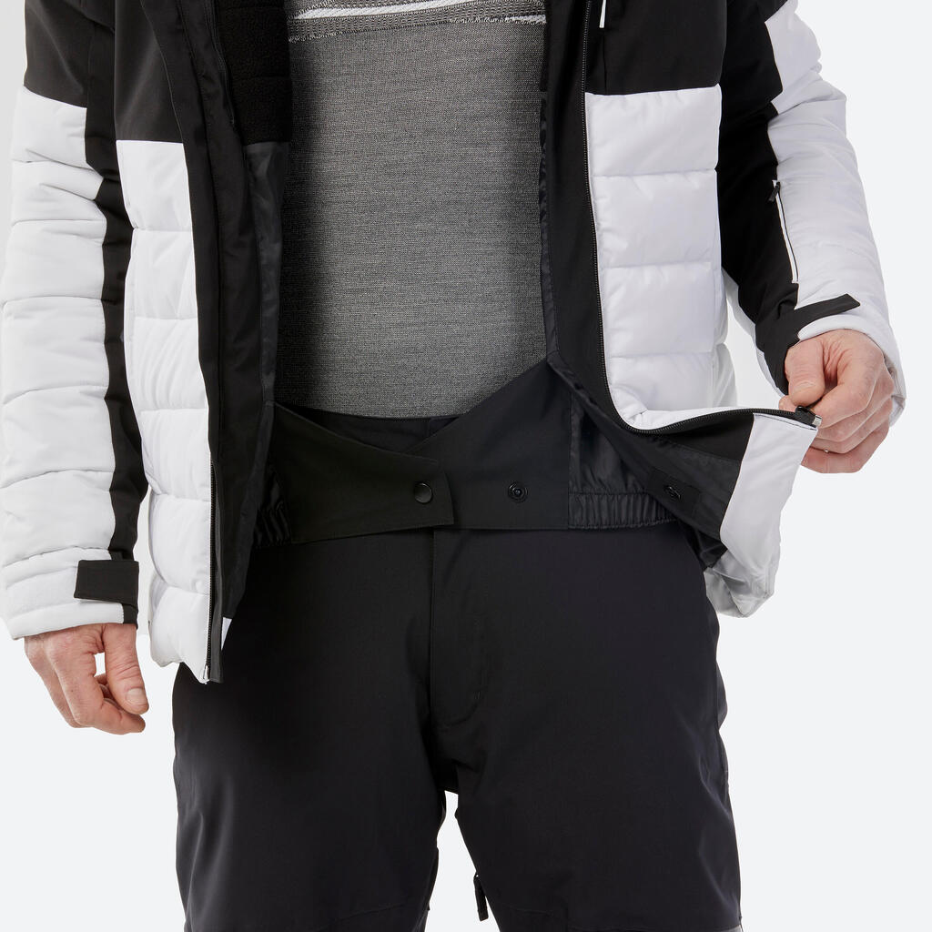 Pánska hrejivá lyžiarska bunda 100 stredne dlhá bielo-čierna