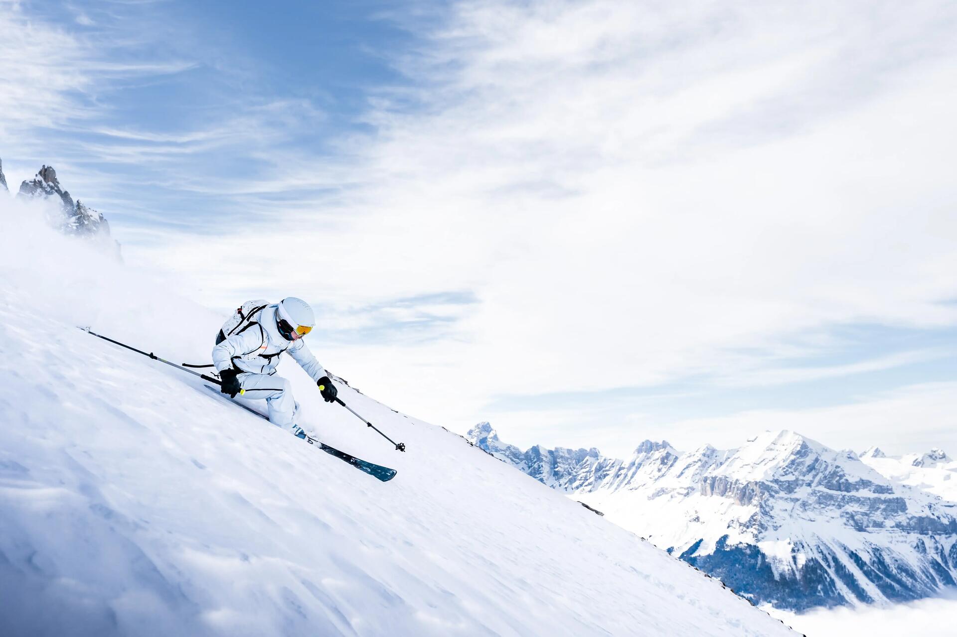 person downhill skiing