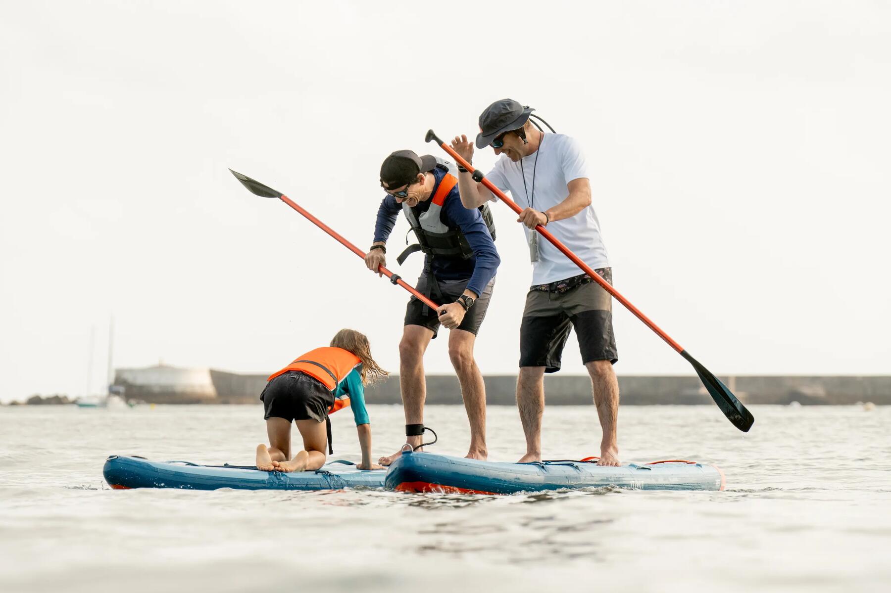 two people paddling on a lake