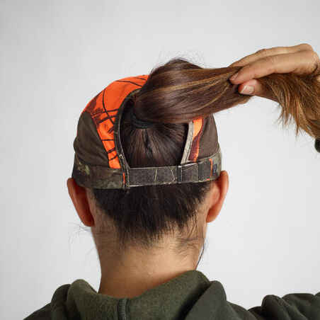 Moteriška lengva medžioklinė orui laidi kepuraitė „500“, oranžinis kamufliažas