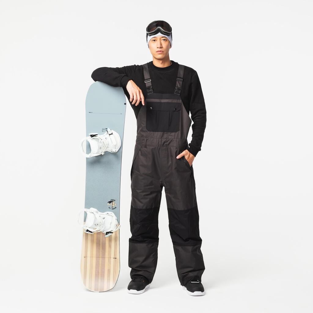 Náprsenkové nohavice SNB 500 na snowboard široké nepremokavé čierne