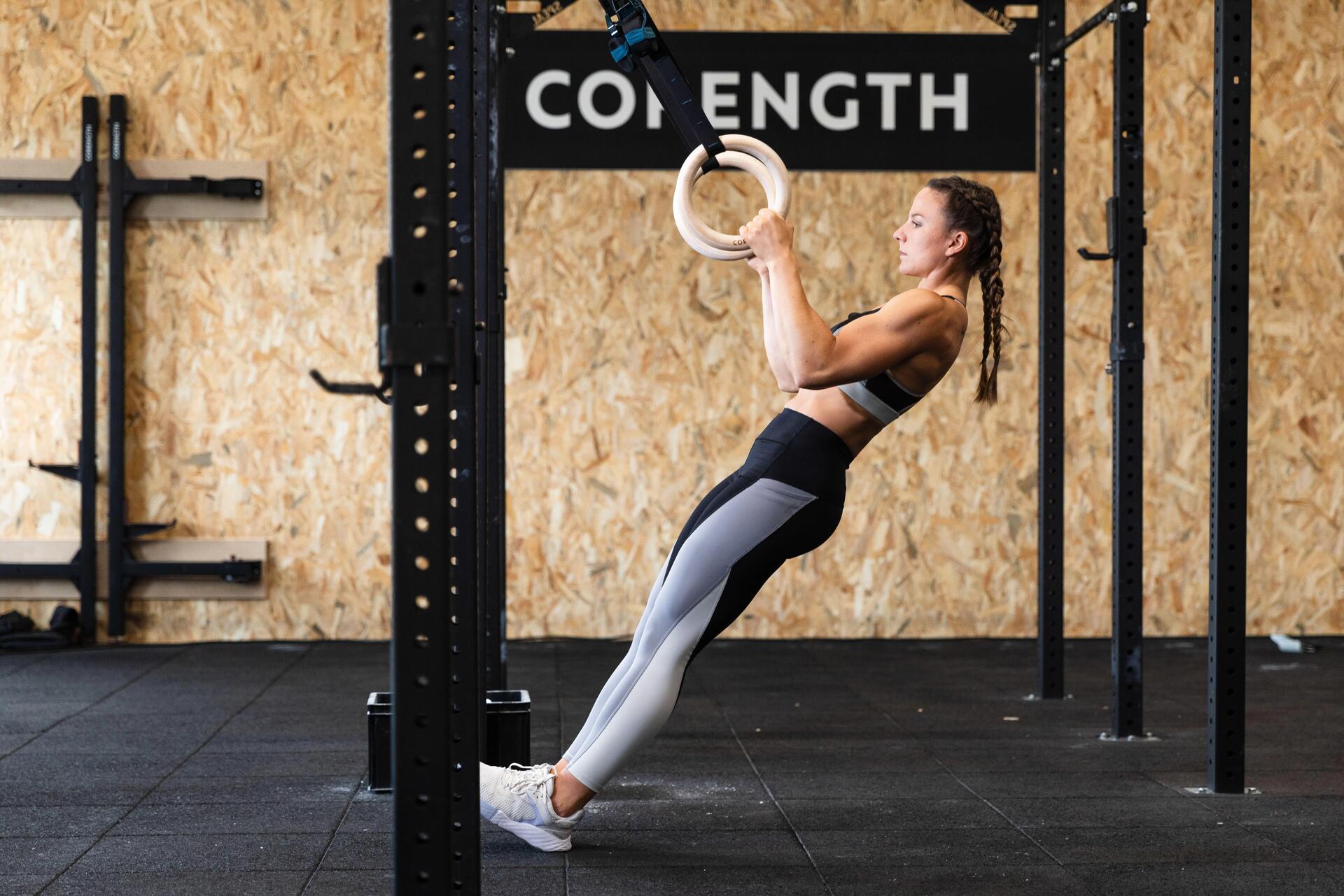 Woman lifting weights in a gym