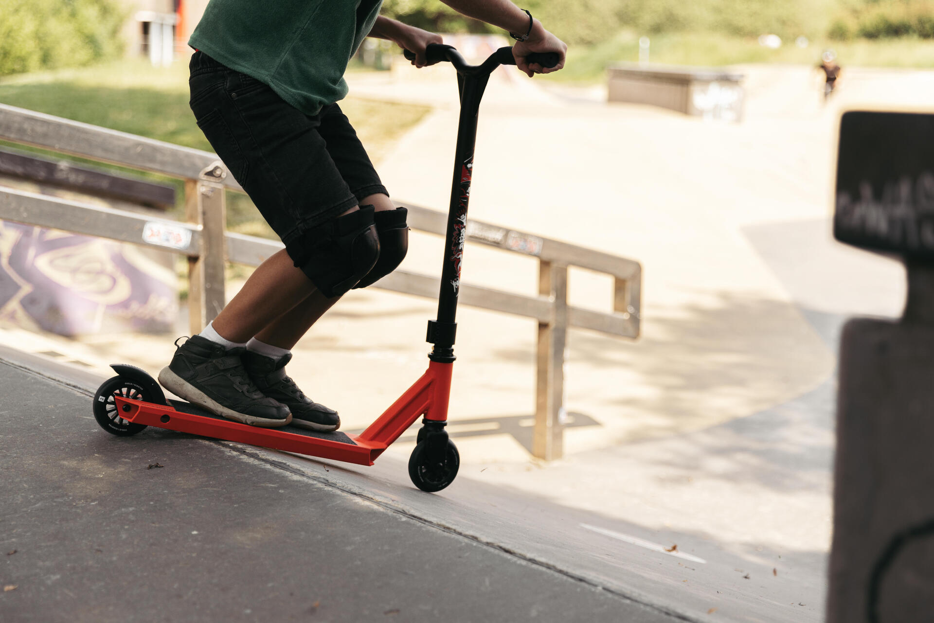 girl performing a Feeble Grind in a skate park