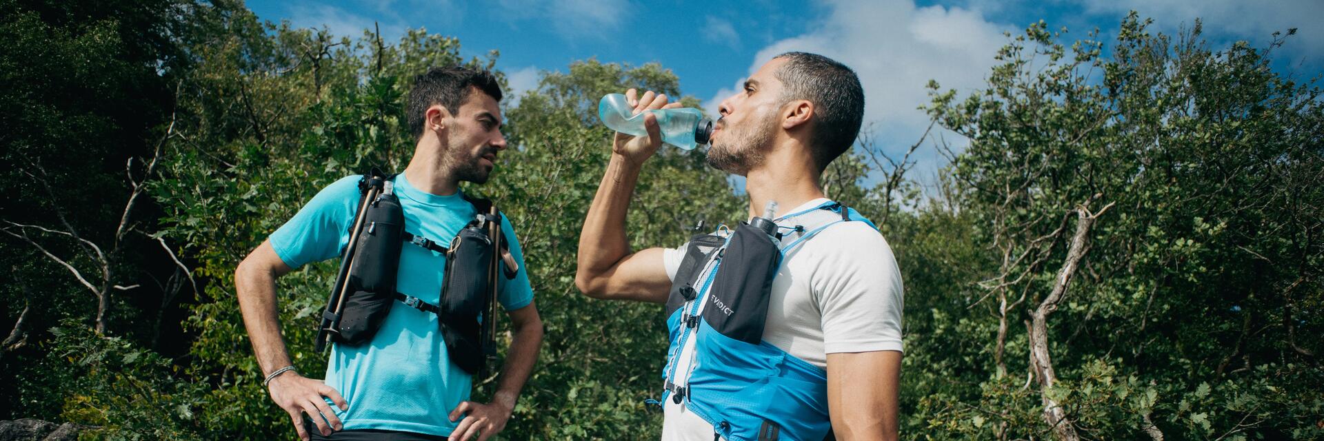 woman drinking water on a hike