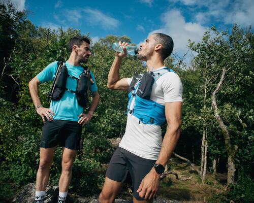 woman drinking water on a hike
