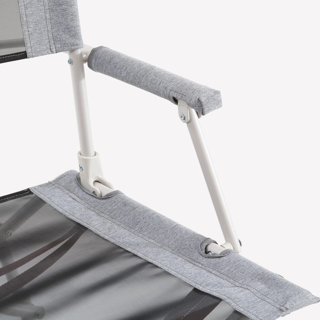 Foldable camping chair with armrest